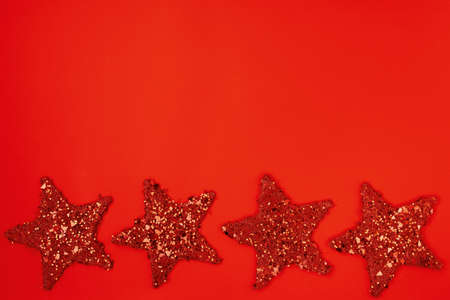flat lay with christmas jingle bells on red background.の写真素材