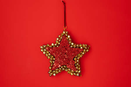 flat lay with christmas jingle bells on red background.の写真素材