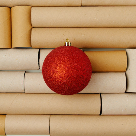 flat lay with broken christmas ball on toilet paper tubes background.の写真素材