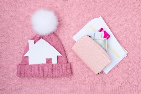 winter flat lay with medical mask and mandarins on white knitted background.の写真素材