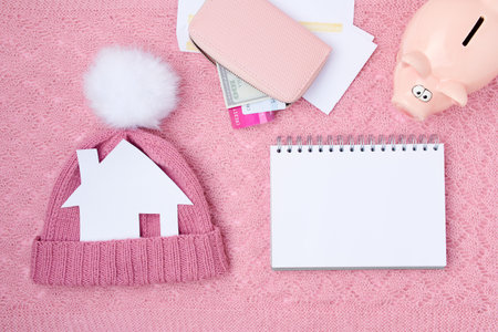 winter flat lay with credit card, cosmetics, snowflake and smartphone on white knitted background.の写真素材