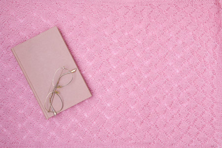 winter flat lay with clock hands, snowflakes, mandarins, sleds and skis on white knitted background.の写真素材