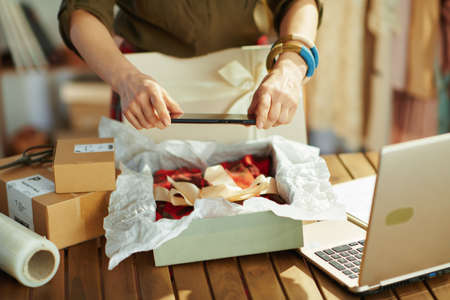 modern 40 years old small business owner woman with clipboard in the office.の写真素材