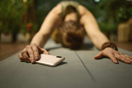 Closeup on woman with tea at green home.の写真素材