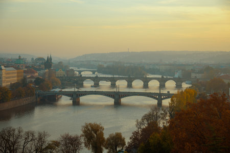 landscape with Vltava river and Karlov bridge at sunset in autumn in Prague, Czech Republic.の写真素材