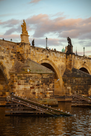 landscape with Karlov bridge in the evening in autumn in Prague, Czech Republic.の写真素材