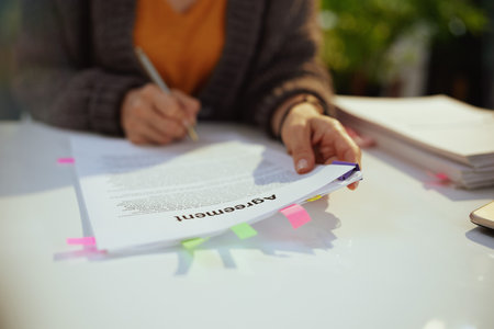 woman reading agreement document.の写真素材