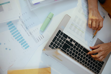 business woman with documents and laptop working.の写真素材