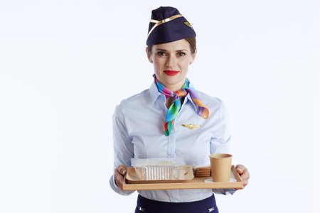 modern female air hostess isolated on white background in uniform with a tray of food.