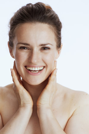 Portrait of happy young female isolated on white.の写真素材
