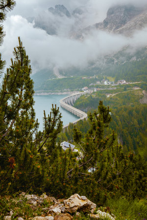 Summer time in the Dolomites. landscape with Fedaia lake and forest.の写真素材