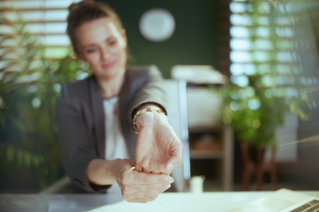 Sustainable workplace. smiling modern business woman at work stretching hands.の写真素材