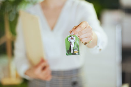 Time to move on. Closeup on elegant 40 years old business woman in modern green office in white...