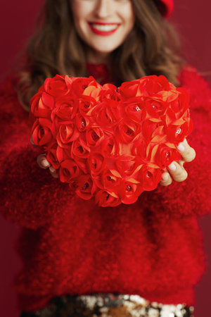 Happy Valentine. Closeup on woman with red heart.の写真素材