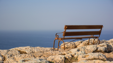 Beautiful wooden bench with seaview on the Cape Greco, Cyprus.の写真素材