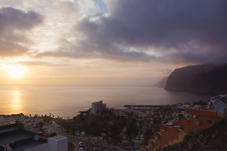 Beautifil view of the Los Gigantes and setting sun. Puerto de Santiago, Tenerife Island, Canary.の写真素材