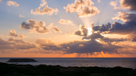 Beautiful sunset view of the Yeronisos or Holy Island - a sanctuary dedicated to Apollo located at...