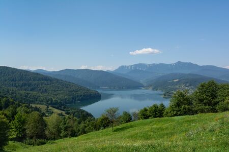 View of Lake Bicaz with Ceahlau Massif on the background, Romaniaの写真素材