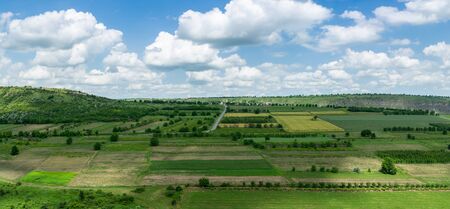 Panorama of moldavian countryside in summer. View of green fields and gardensの写真素材