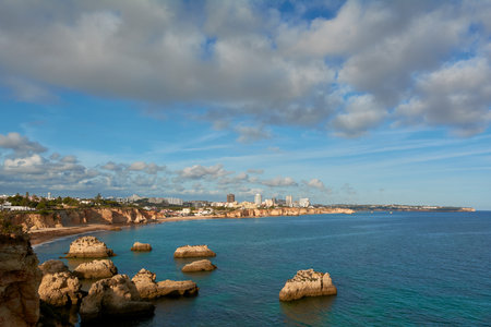 Beautiful view of the sweeping coastline from Alvor to Portimao in Algarve region, Portugalの写真素材