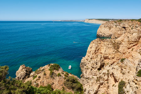 Typical view of the Lagos coastline. Panoramic view of the Algarve shore in Portugalの写真素材