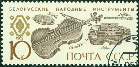 USSR - CIRCA 1989  A stamp printed in the USSR shows Belorussian folk music instruments, circa 1989のeditorial素材