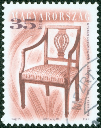 HUNGARY - CIRCA 2003  stamp printed by Hungary, shows antique chair, circa 2003のeditorial素材