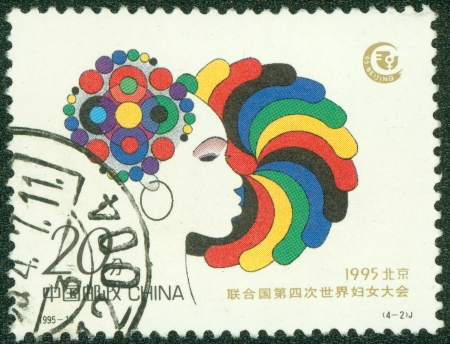 CHINA - CIRCA 1995  A stamp printed in CHINA shows Head of a woman, circa 1995の写真素材