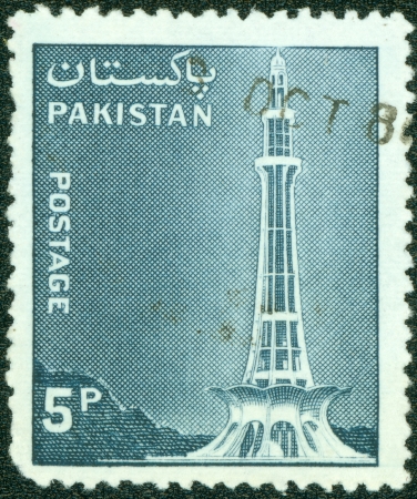 PAKISTAN - CIRCA 1978  A stamp printed in Pakistan shows Minar-e-Pakistan  Pakistan Day Memorial , Tractor and Mausoleum of Ibrahim Khan Makli, Tahtta, circa 1978の写真素材