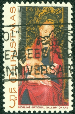 USA - CIRCA 1966- American Christmas postage stamp shows Madonna and Child based on a painting by the Flemish artist Hans Memling, circa 1966 のeditorial素材