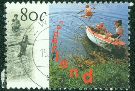 NETHERLANDS - CIRCA 1997  Water Recreation  Boat near coast, circa 1997 のeditorial素材