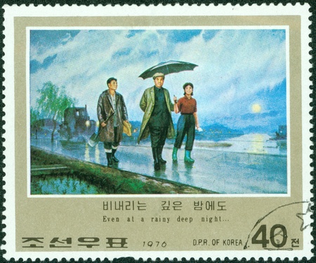 NORTH KOREA - CIRCA 1976  A stamp printed in DPR KOREA shows image of korean, Even at a rainy deep night   , circa 1976のeditorial素材