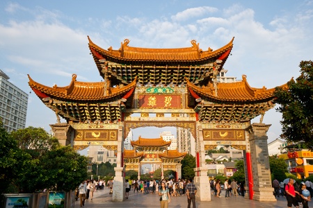 KUNMING, YUNNAN - August 17  People walk under the Golden Horse Memorial Archway JinMaBiJi fang  on August 17, 2012 in Kunming of Yunnan Province  のeditorial素材