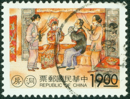 TAIWAN - CIRCA 1990  A stamp printed in Taiwan shows a traditional painting of Bridal chamber, circa 1990の写真素材
