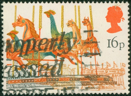 UNITED KINGDOM - CIRCA 1983  A stamp printed in the UK shows Merry-go-round from British Fairs, series, circa 1983のeditorial素材