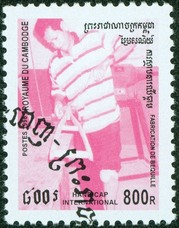 CAMBODIA - CIRCA 1996  a stamp printed by Cambodia, shows a carpenter, circa 1996 のeditorial素材