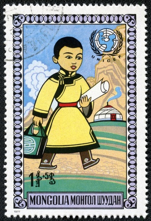 MONGOLIA - CIRCA 1977  A stamp printed by Mongolia, shows Walking boy, circa 1977のeditorial素材