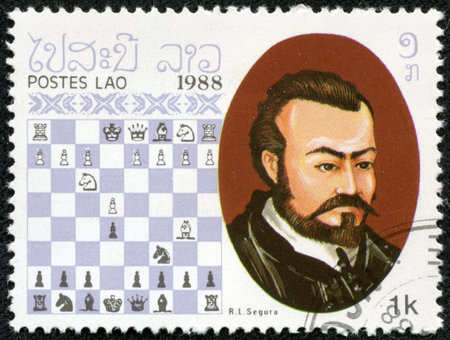 LAOS - CIRCA 1988  A stamp printed in Laos, shows Rodrigo  Ruy  Lopez de Segura , Chess Champion, circa 1988のeditorial素材