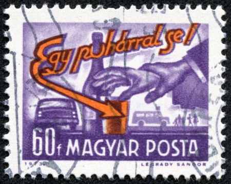 HUNGARY - CIRCA 1973  A stamp printed in the Hungary shows hand, a glass and bottle, inscription Not even one drink, circa 1973のeditorial素材