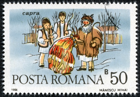 ROMANIA - CIRCA 1986  stamp printed by Romania, shows Folk Costumes, Capra, circa 1986の写真素材