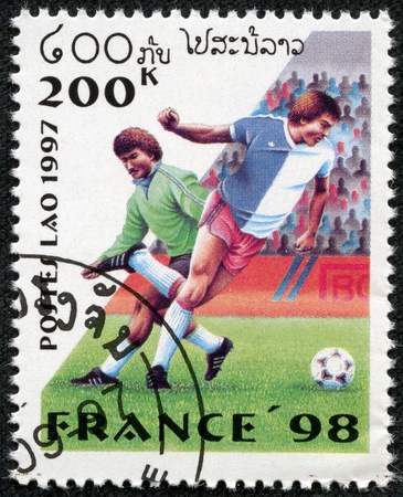 LAOS - CIRCA 1997  A stamp printed in Laos dedicated to Soccer World Championship of France 1998, circa 1997のeditorial素材