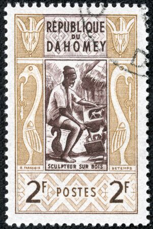 DAHOMEY CIRCA 1961  stamp printed in Dahomey shows Wood sculptor, circa 1961のeditorial素材