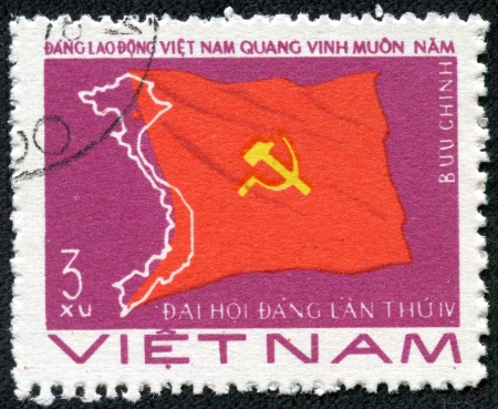 VIETNAM - CIRCA 1976  A stamp printed in Viet Nam showing flag with sickle and hammer,devoted to the Viet Nam Worker s Party, 4th Natl Congress, circa 1976のeditorial素材