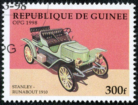GUINEA - CIRCA 1998  A stamp printed in Guinea showing vintage car, circa 1998のeditorial素材