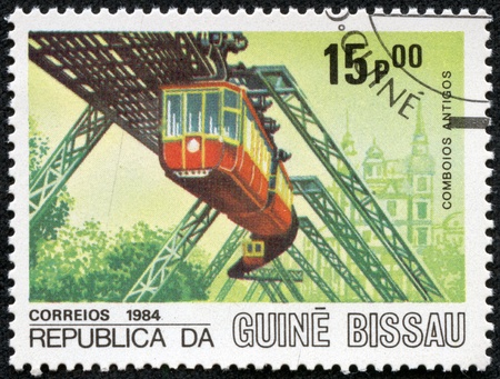 GUINEA - CIRCA 1984  A stamp printed in Republic of Guinea Bissau shows engine, circa 1984のeditorial素材