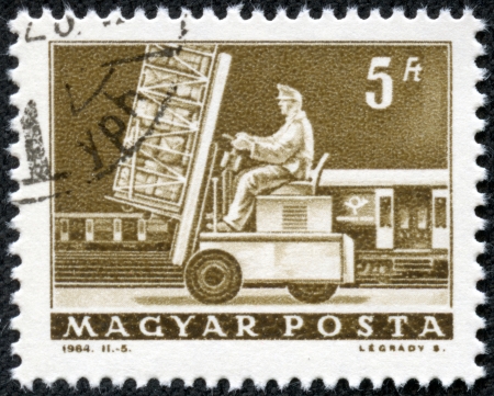 HUNGARY - CIRCA 1964  A stamp printed in Hungary shows Post loading, without inscription, from the series  Transport and Telecommunication a mp;q uot;, circa 1964 のeditorial素材