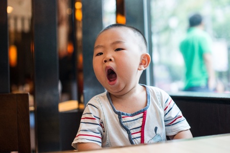 Asian boy  In the restaurantの写真素材