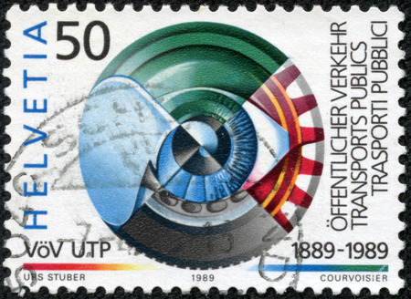 SWITZERLAND - CIRCA 1989  a stamp printed in the Switzerland shows Eye, Modes of Transportation, Centenary of Public Transport Association, circa 1989のeditorial素材