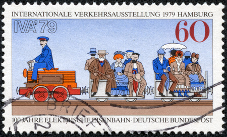 GERMANY - CIRCA 1979  A stamp printed in Germany, is dedicated to International Transportation Exhibition, Hamburg, shows First Electric Train, 1879 Berlin Exhibition, circa 1979のeditorial素材