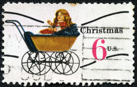 UNITED STATES OF AMERICA - CIRCA 1970  a stamp printed in the USA shows Doll Carriage, Toy, Christmas, circa 1970の写真素材
